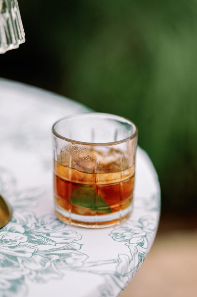 Ember & Orange Old Fashioned served with smoke box at a Texas wedding