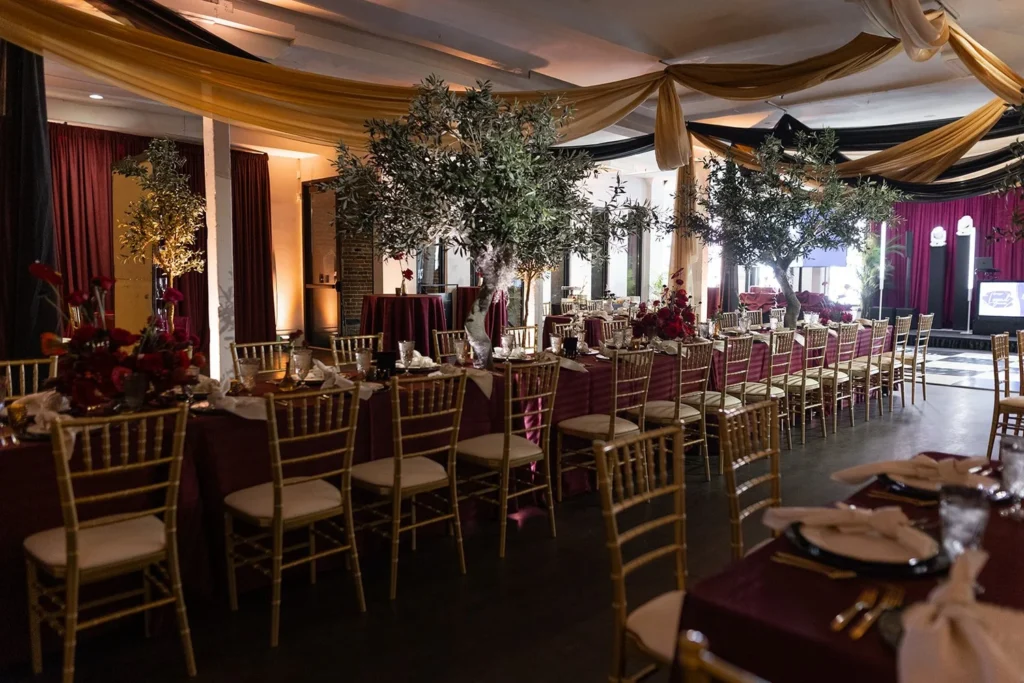 Apollo Hall Denver holiday event venue with historic brick walls and custom bar